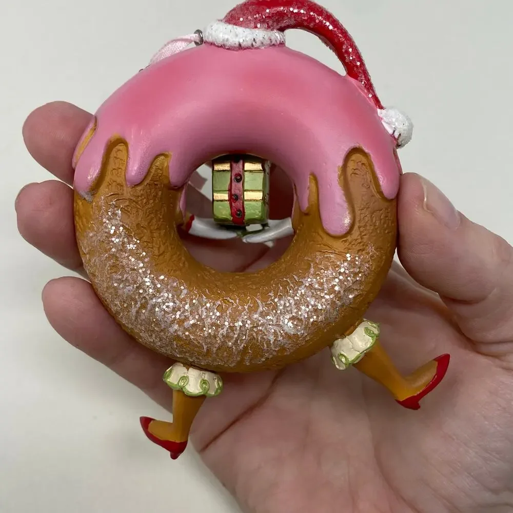 Ornament donut with face and legs